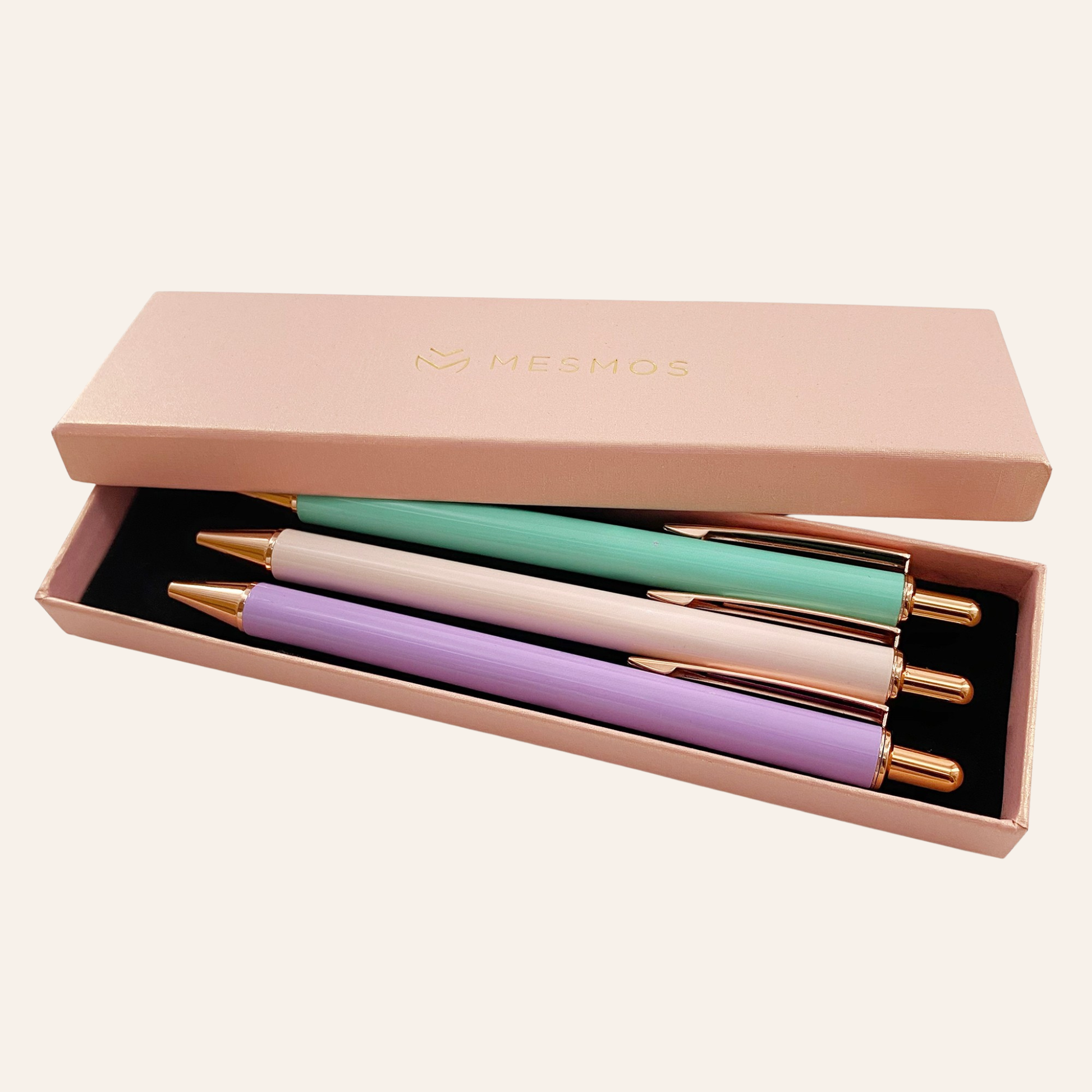 Set of four pastel-colored pens in a pink box with 'Festus' branding.-1